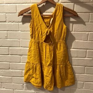 Girl’s cute summer dress. mustard color
